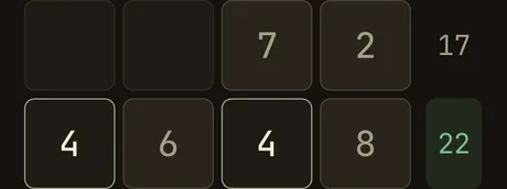 A band of a Crossums grid mid-solve — filled cells and target sums